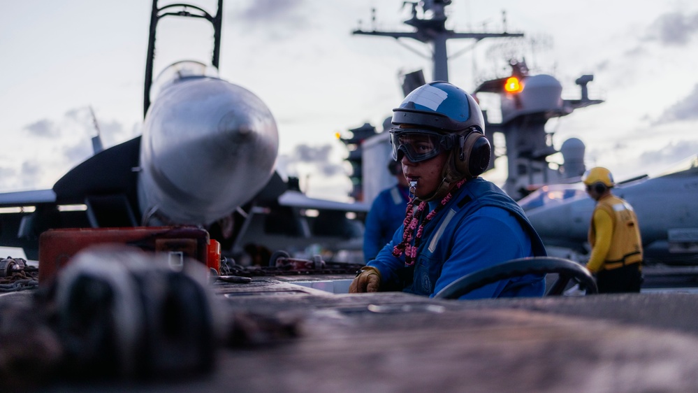 Sailors Move Aircraft on the Flight Deck of USS George Washington