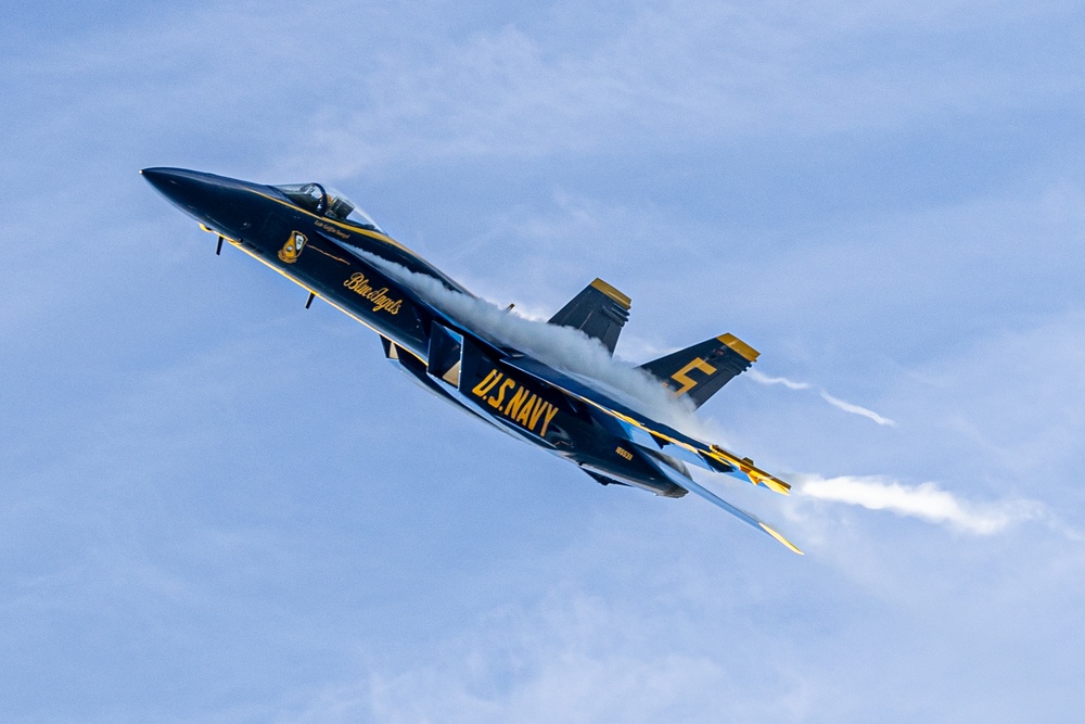 U.S. Navy Flight Demonstration Squadron, the Blue Angels, perform aerobatic formation maneuvers over San Francisco