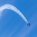 U.S. Navy Flight Demonstration Squadron, the Blue Angels, perform aerobatic formation maneuvers over San Francisco