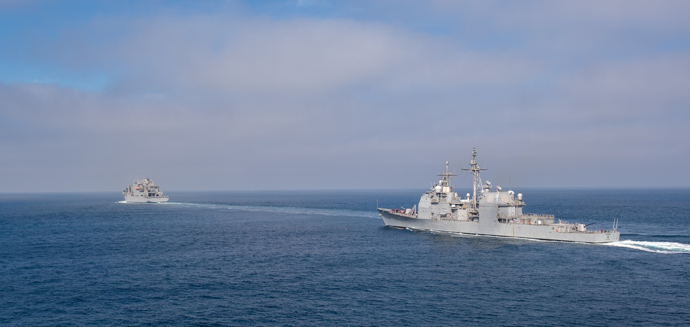 USS Chosin (CG 65) and USNS Washington Chambers (T-AKE-11) conduct a Transferrable Rearming Mechanism (TRAM)