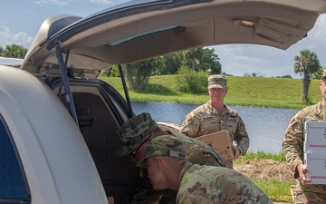 Florida Army National Guard mortarmen distribute emergency supplies after Hurricane Milton