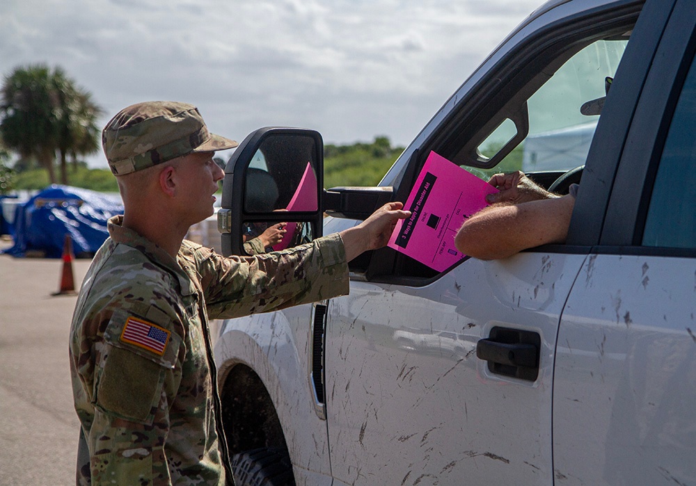 Florida Army National Guard mortarmen distribute emergency supplies after Hurricane Milton