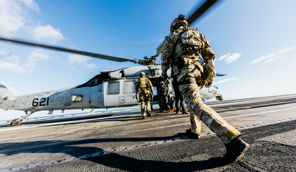 Explosive Ordnance Disposal Technicians Fast-Rope on the Flight Deck of USS George Washington