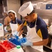 USS John C. Stennis (CVN 74) Sailors decorate 249th Navy birthday cake
