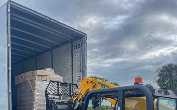 Florida Army National Guard mortarmen set up point-of-distribution site to deliver emergency supplies after Hurricane Milton