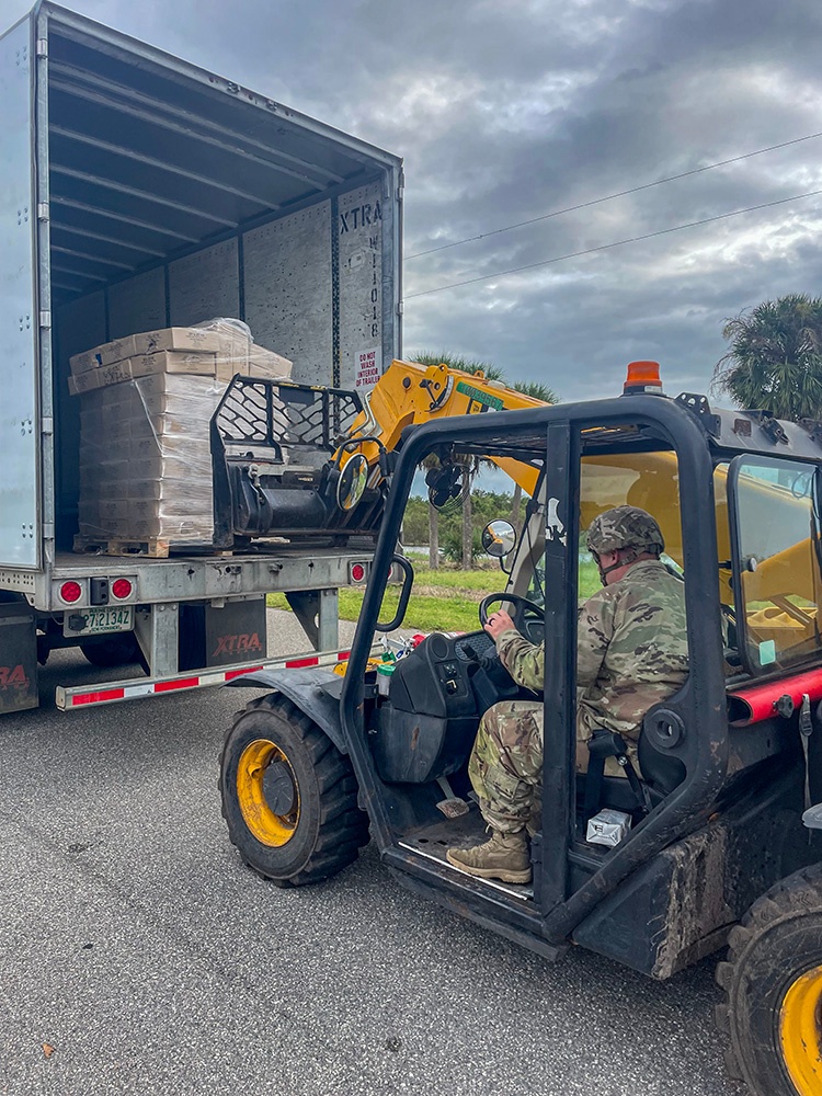 Florida Army National Guard mortarmen set up point-of-distribution site to deliver emergency supplies after Hurricane Milton