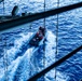 USS George Washington Sailors launch a rigid-hull inflatable boat while underway