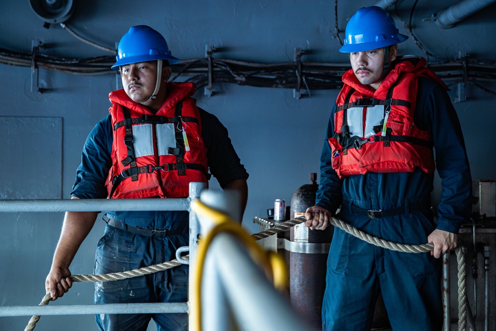 USS George Washington Sailors launch a rigid-hull inflatable boat while underway