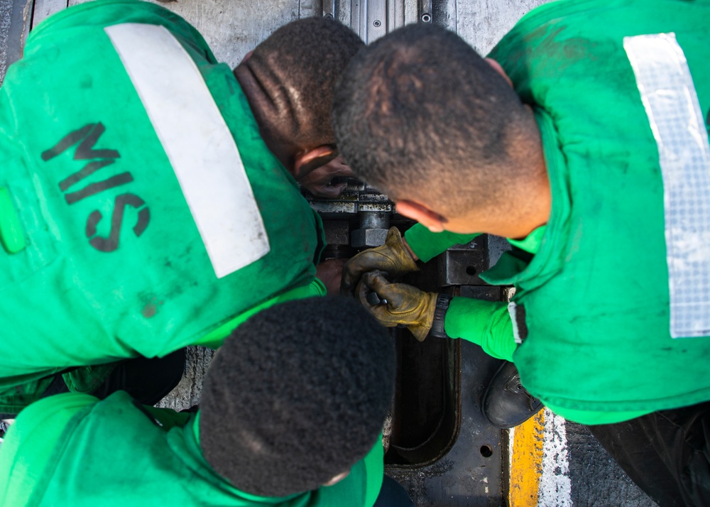 USS George Washington Sailors Repair Catapult Nose Assembly