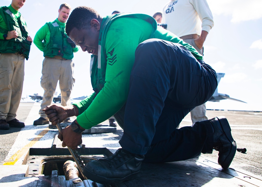 USS George Washington Sailors Repair Catapult Nose Assembly