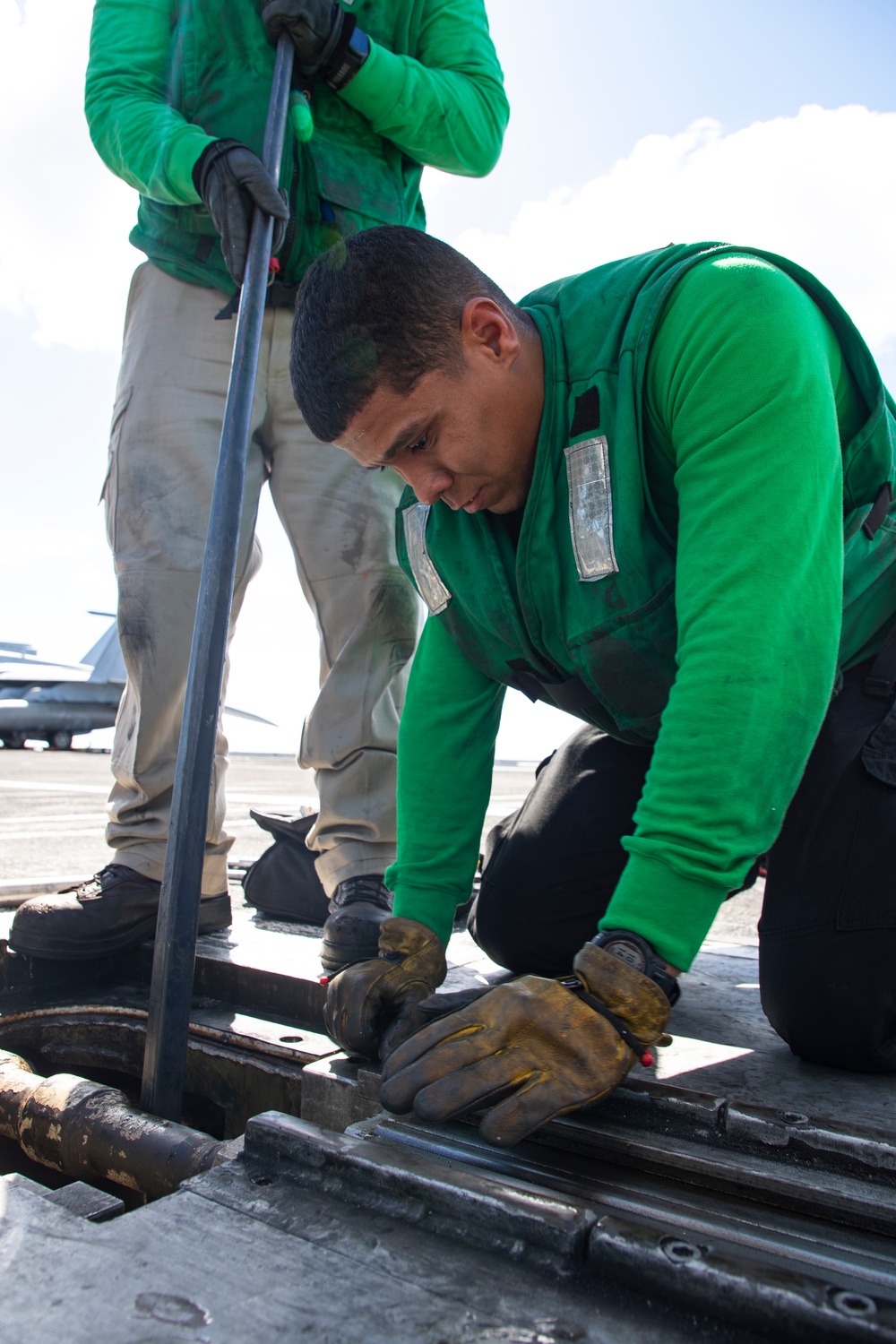 USS George Washington Sailors Repair Catapult Nose Assembly