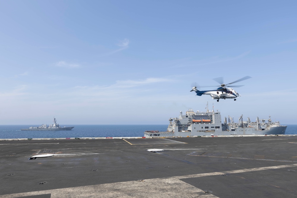 Abraham Lincoln conducts a replenishment-at-sea with Amelia Earhart