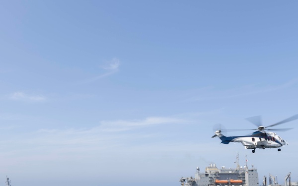 Abraham Lincoln conducts a replenishment-at-sea with Amelia Earhart