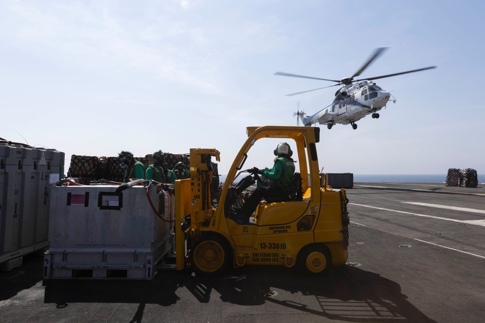 Abraham Lincoln conducts a replenishment-at-sea with Amelia Earhart