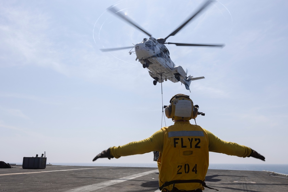 Abraham Lincoln conducts a replenishment-at-sea with Amelia Earhart