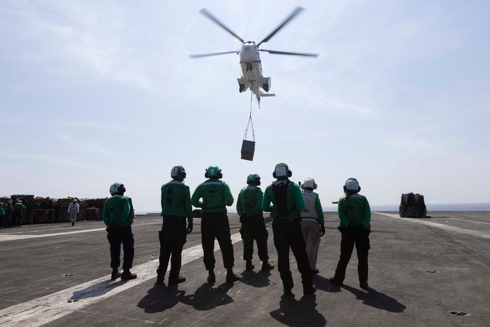 Abraham Lincoln conducts a replenishment-at-sea with Amelia Earhart