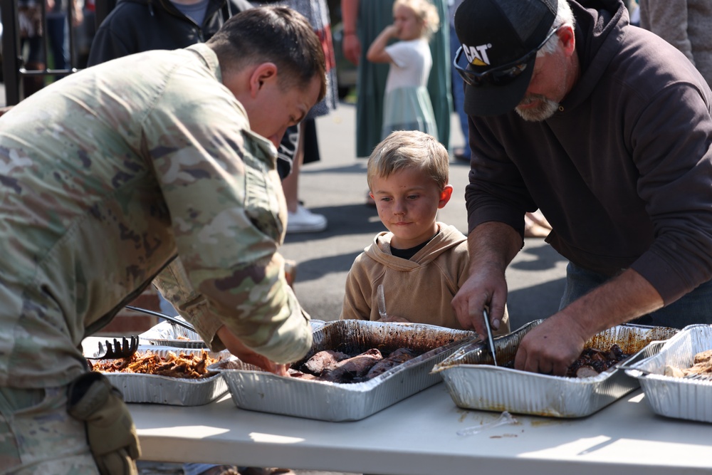 U.S. Army Soldiers assigned to the Bravo Company, 1st Battalion, 325th Airborne Infantry Regiment, 82nd Airborne Division, serve hot meals to local communities.