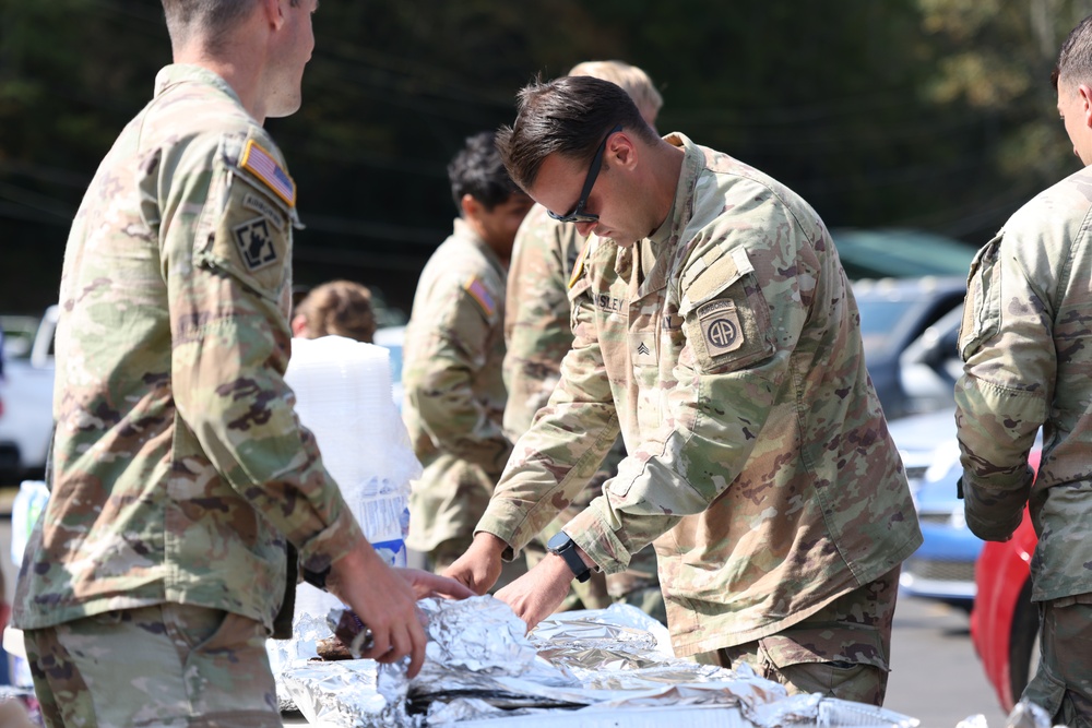 U.S. Army Soldiers assigned to the Bravo Company, 1st Battalion, 325th Airborne Infantry Regiment, 82nd Airborne Division, serve hot meals to local communities.