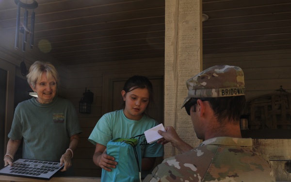 U.S. Army Soldiers assigned to the Bravo Company, 1st Battalion, 325th Airborne Infantry Regiment, 82nd Airborne Division, serve hot meals to local communities.