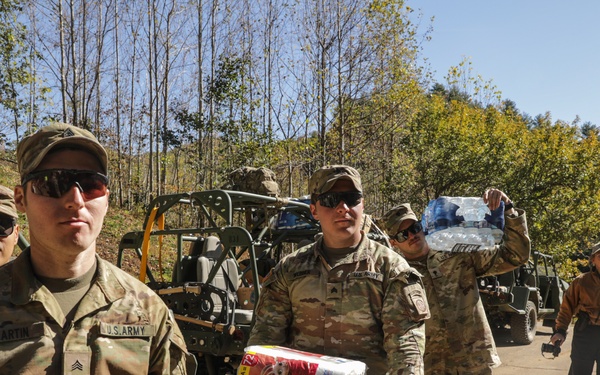 Soldiers assigned to Joint Task Force - Civil Support work to deliver supplies and resources to local families