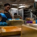 A Culinary Specialist Decorates a Cake in the Bake Shop