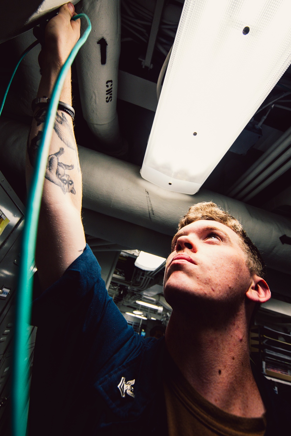 Information Systems Technicians install network cables aboard USS George Washington