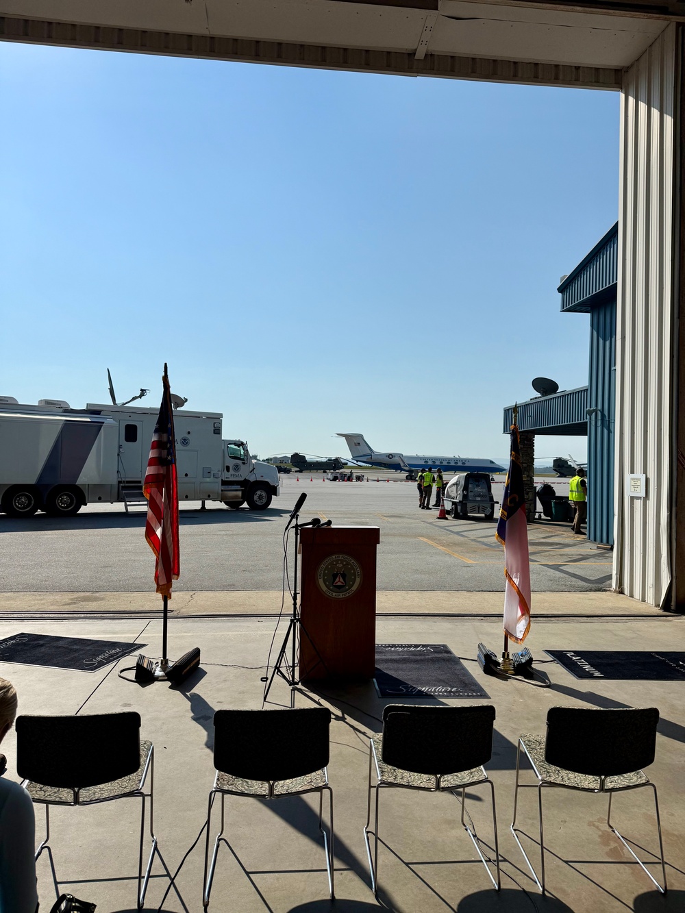 Gov. Roy Cooper holds a presser on Asheville Tarmac