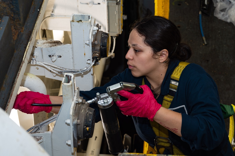 An Aviation Ordnanceman Performs Maintenance on a Weapons Elevator