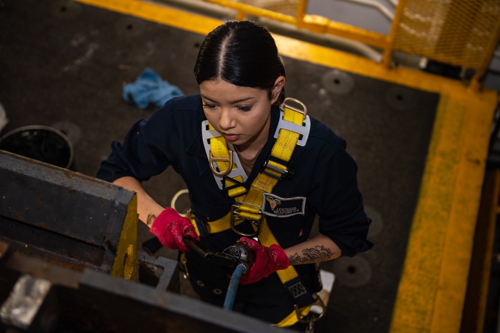 Aviation Ordnanceman Performs Maintenance on a Weapons Elevator