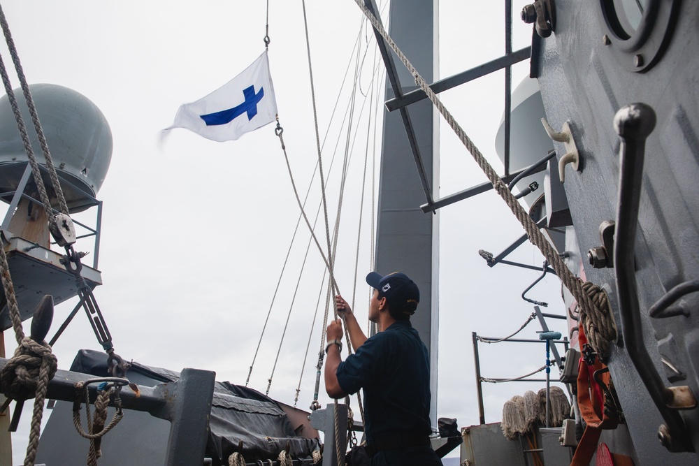 USS John S. McCain raises the Church Pennant