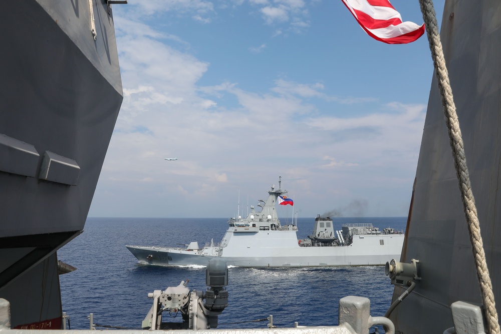 Sailors aboard USS Howard (DDG 83) conduct a replenishment-at-sea exercise during Sama Sama 2024