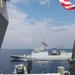 Sailors aboard USS Howard (DDG 83) conduct a replenishment-at-sea exercise during Sama Sama 2024