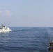 Sailors aboard USS Howard (DDG 83) conduct a replenishment-at-sea exercise during Sama Sama 2024