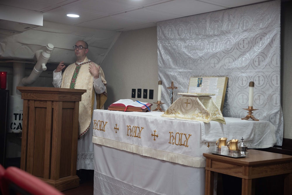 USS George Washington Sailors hold Catholic Mass