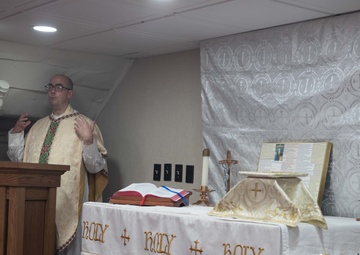 USS George Washington Sailors hold Catholic Mass