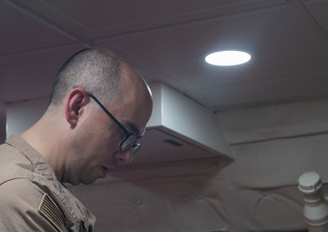 USS George Washington Sailors hold Catholic Mass