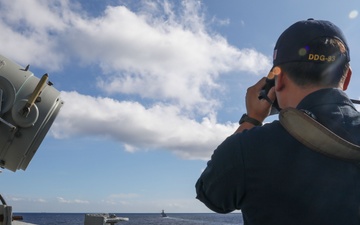 USS Howard (DDG 83) participates in an anti-submarine exercise during Sama Sama 2024 in the South China Sea