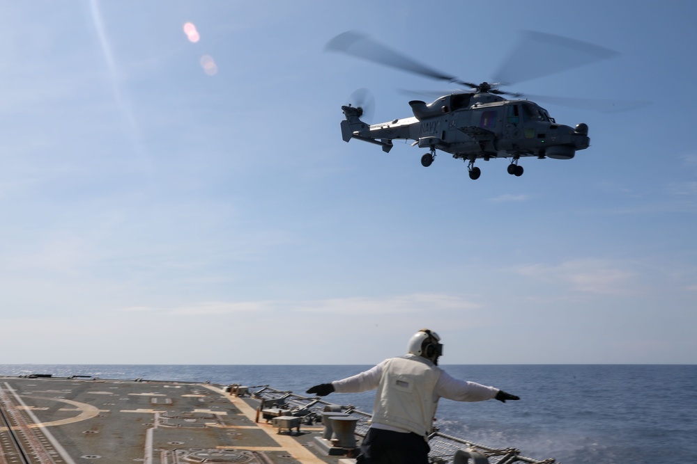 USS Howard conducts flight quarters with an AgustaWestland AW159 Wildcat helicopter from the BRP Jose Rizal during Sama Sama 2024 in the South China Sea