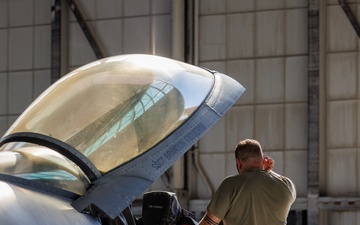 Maintainer Works on a F-16C