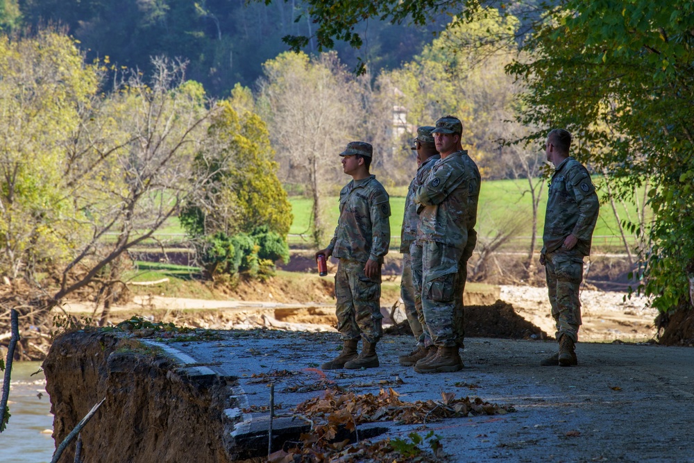 North Carolina National Guard Soldiers reinforce a temporary dirt roadway
