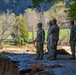 North Carolina National Guard Soldiers reinforce a temporary dirt roadway