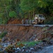 North Carolina National Guard Soldiers reinforce a temporary dirt roadway