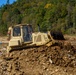 North Carolina National Guard Soldiers reinforce a temporary dirt roadway