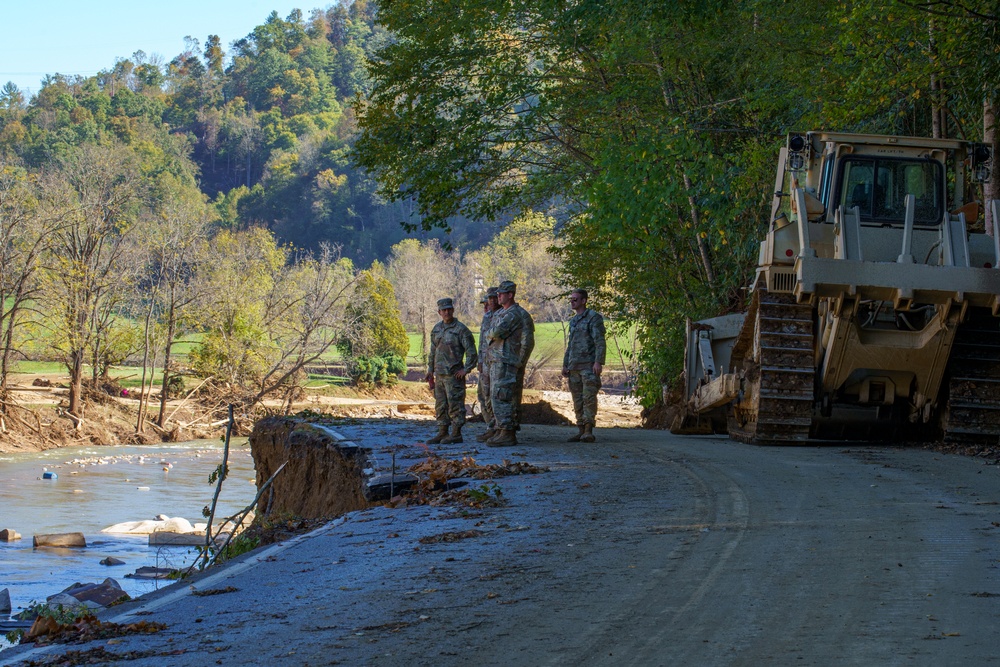 North Carolina National Guard Soldiers reinforce a temporary dirt roadway