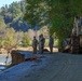 North Carolina National Guard Soldiers reinforce a temporary dirt roadway