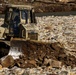 North Carolina National Guard Soldiers reinforce a temporary dirt roadway
