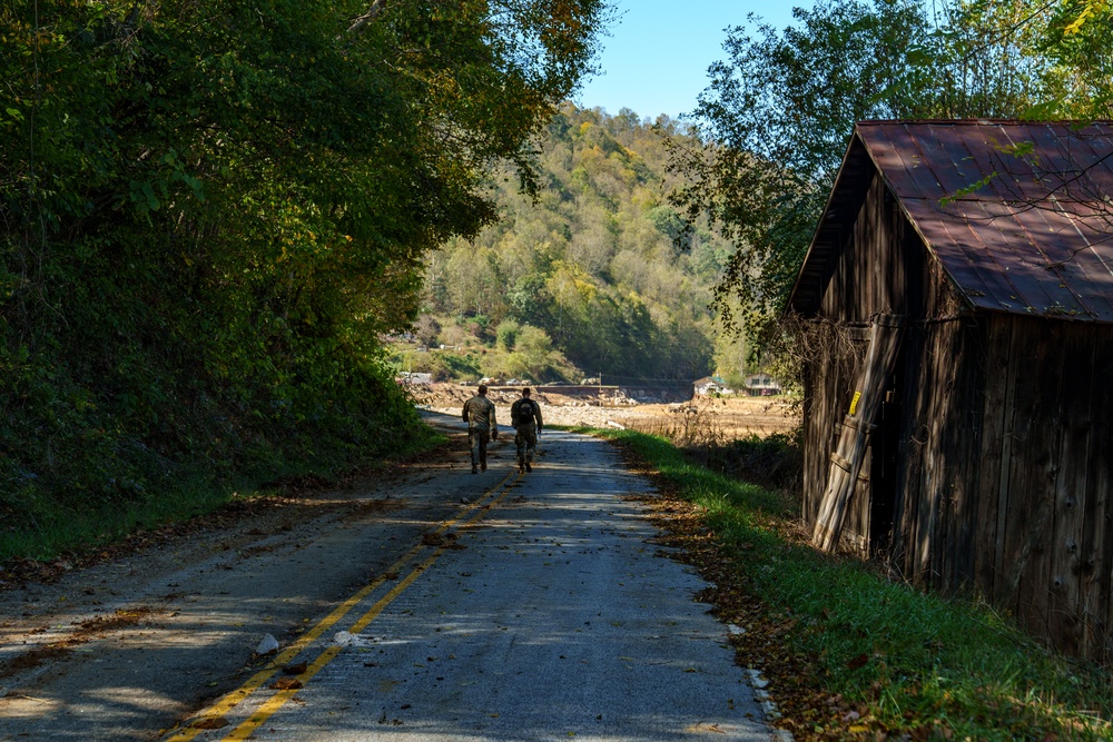 North Carolina National Guard Soldiers reinforce a temporary dirt roadway