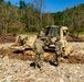 North Carolina National Guard Soldiers reinforce a temporary dirt roadway
