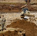 North Carolina National Guard Soldiers reinforce a temporary dirt roadway