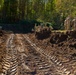 North Carolina National Guard Soldiers reinforce a temporary dirt roadway